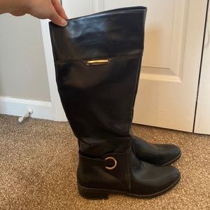 Tall black riding boots